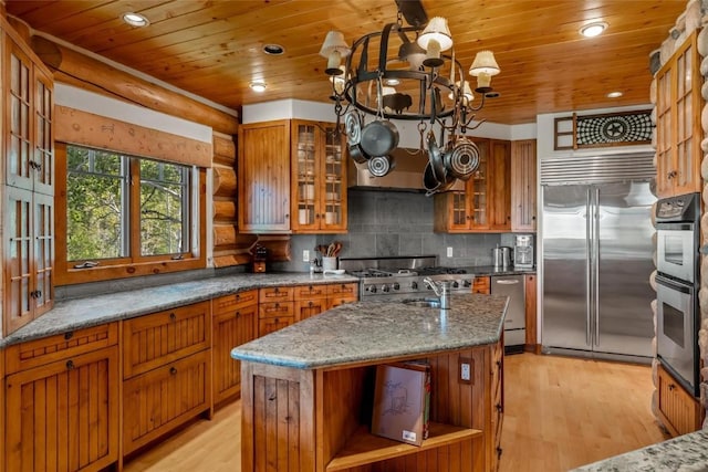 kitchen featuring light stone counters, light hardwood / wood-style floors, stainless steel appliances, a center island with sink, and wooden ceiling