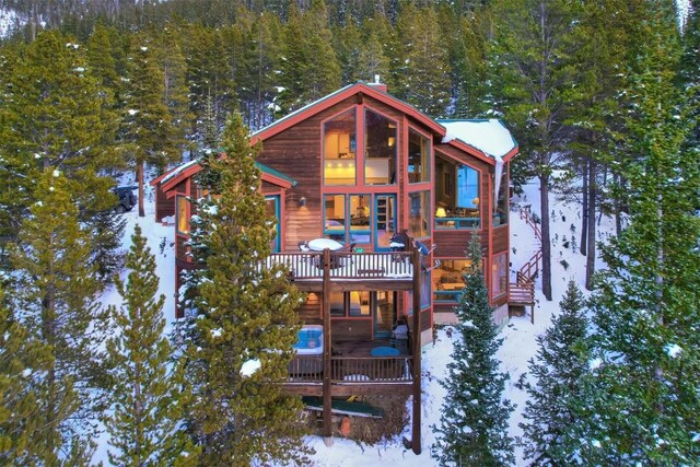 view of snow covered house