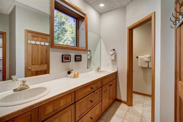 bathroom featuring tile patterned flooring and vanity