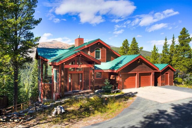 view of front of house with a mountain view and a garage