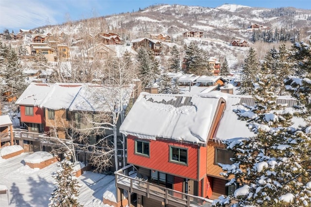 snowy aerial view with a mountain view