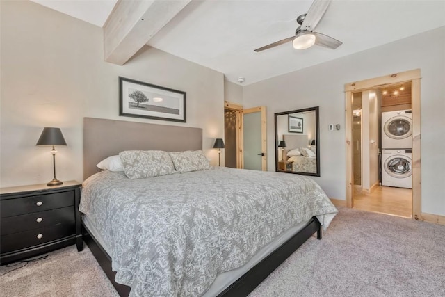 bedroom featuring ceiling fan, light carpet, beam ceiling, and stacked washing maching and dryer