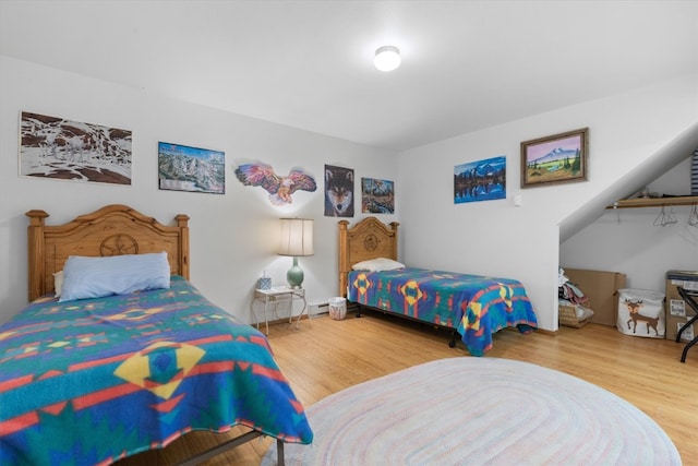 bedroom featuring wood finished floors