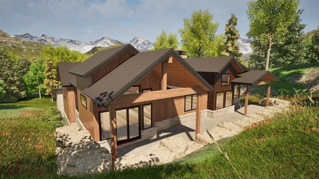 back of house with a mountain view and a patio