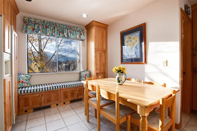 dining space with light tile patterned floors