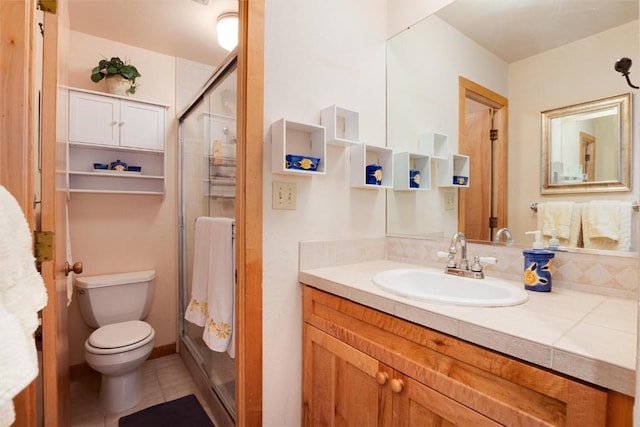 bathroom with walk in shower, tile patterned floors, vanity, and toilet