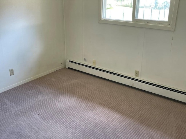 unfurnished room featuring baseboards, a baseboard radiator, and light colored carpet