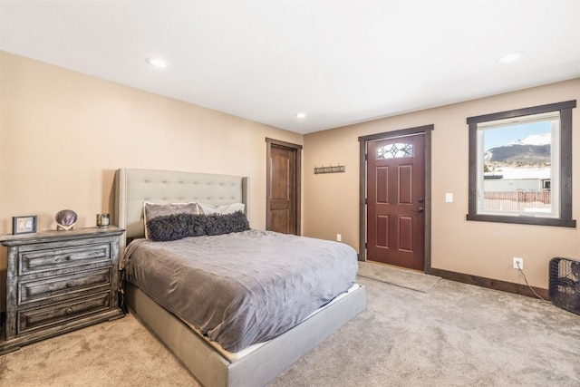 bedroom featuring light carpet