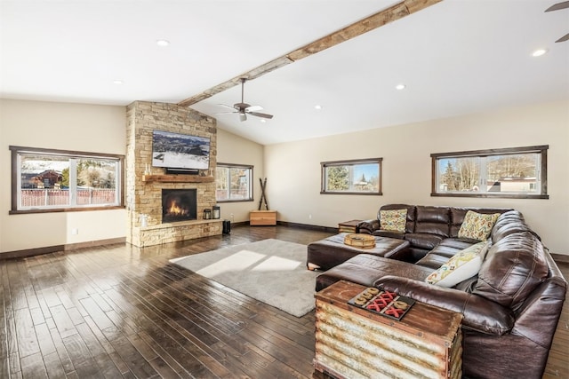 living room with ceiling fan, a fireplace, lofted ceiling with beams, and dark hardwood / wood-style floors