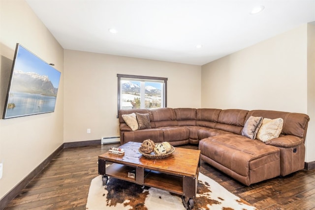 living room featuring dark hardwood / wood-style floors and baseboard heating