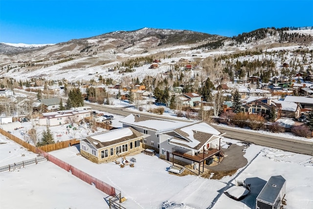 snowy aerial view featuring a mountain view