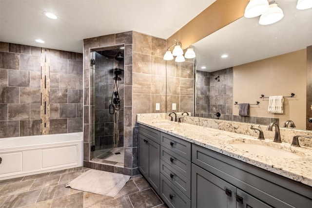 bathroom with vanity, tile walls, and independent shower and bath