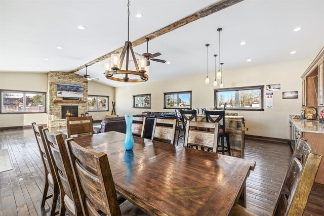 dining area featuring an inviting chandelier and dark wood-type flooring