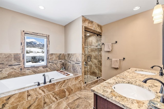 bathroom featuring plus walk in shower and vanity