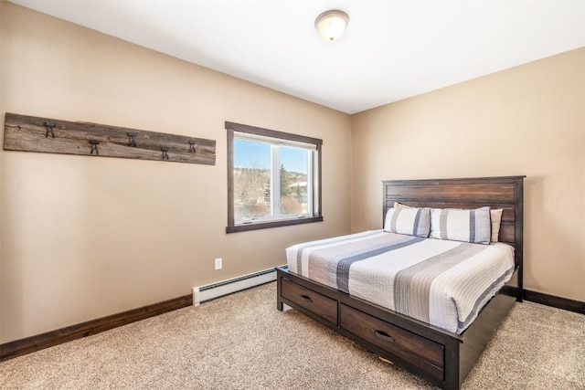 carpeted bedroom with baseboard heating