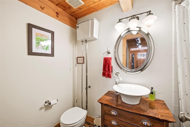 bathroom featuring toilet, vanity, a shower with curtain, and wooden ceiling