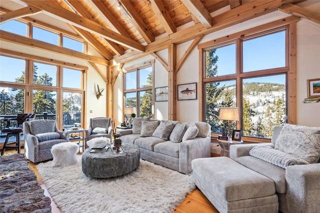 living room with high vaulted ceiling, wood ceiling, beamed ceiling, and hardwood / wood-style floors