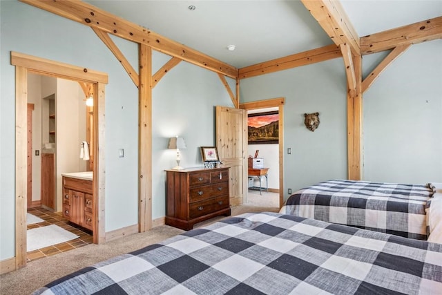 carpeted bedroom with ensuite bath