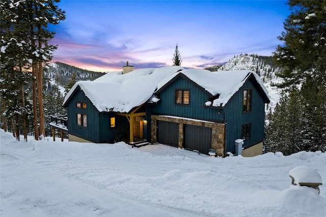 view of front of house featuring a mountain view and a garage