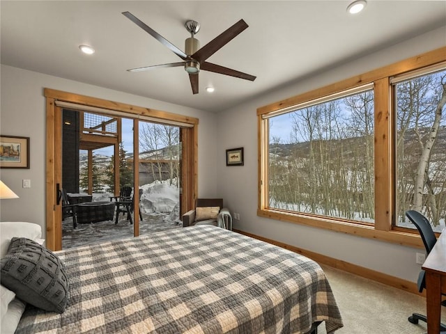 bedroom with recessed lighting, multiple windows, baseboards, and carpet