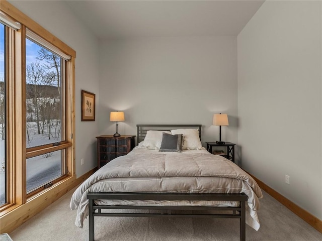 bedroom with carpet and baseboards