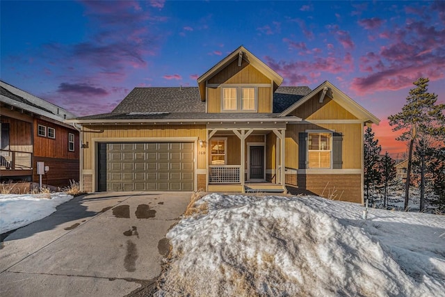 craftsman-style home featuring a garage and a porch