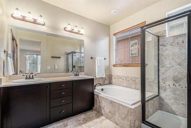 bathroom with vanity, tile patterned flooring, and shower with separate bathtub