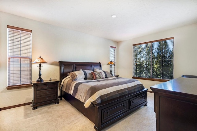 bedroom with light colored carpet