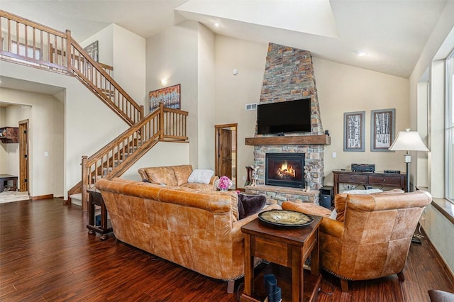 living room featuring a fireplace, high vaulted ceiling, and dark hardwood / wood-style floors