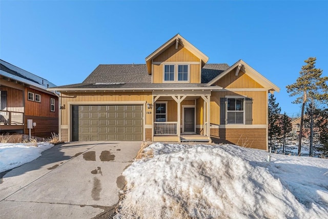 view of front of property with a garage and covered porch