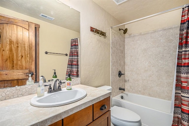 full bathroom with vanity, toilet, and shower / bath combo with shower curtain