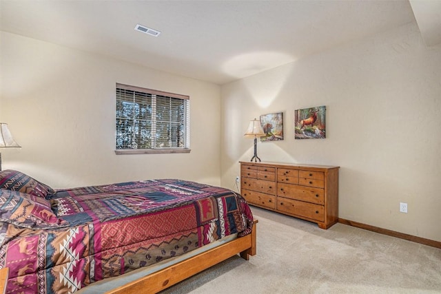 bedroom with light carpet