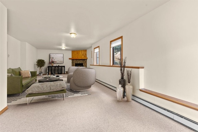 bedroom featuring a fireplace, carpet flooring, and baseboard heating