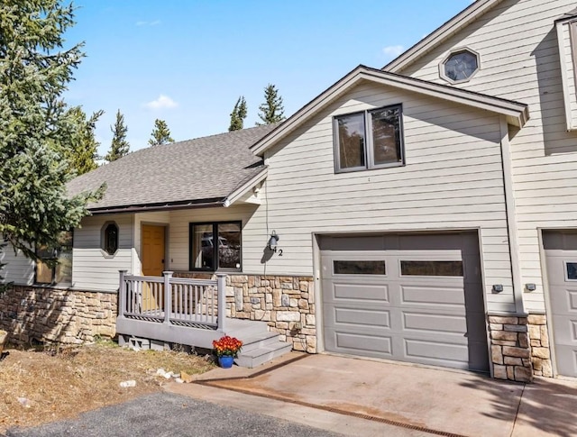 view of front of house featuring covered porch and a garage