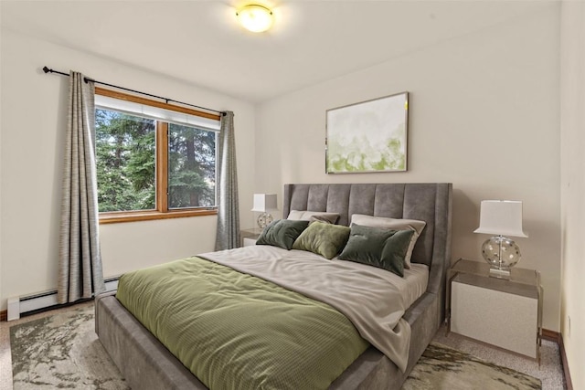 carpeted bedroom featuring a baseboard radiator