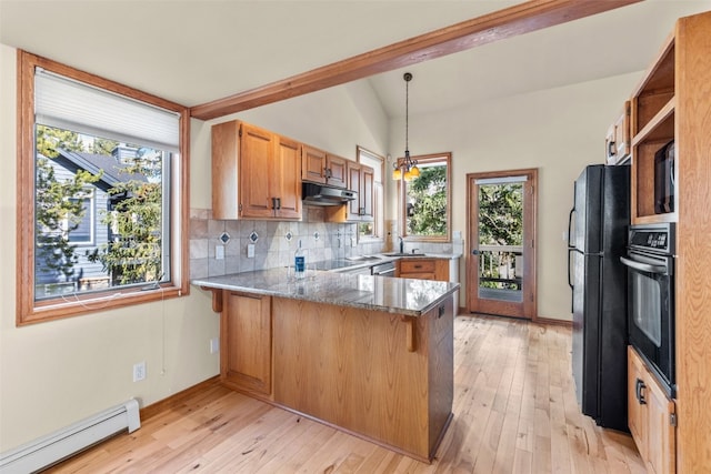 kitchen with sink, hanging light fixtures, a baseboard radiator, kitchen peninsula, and black appliances