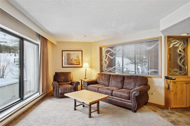 living area featuring a baseboard radiator and a textured ceiling