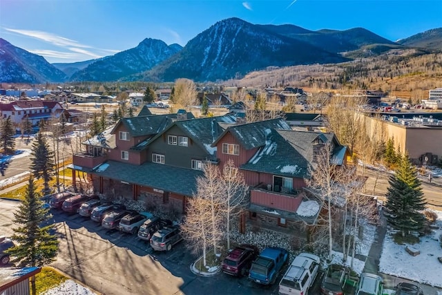 birds eye view of property with a mountain view