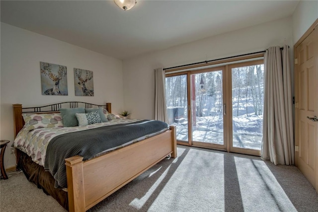 carpeted bedroom featuring access to exterior