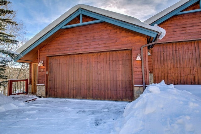 view of snow covered garage