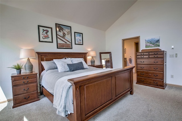 carpeted bedroom with high vaulted ceiling