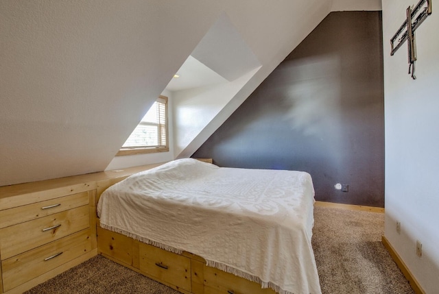 bedroom featuring light carpet and vaulted ceiling