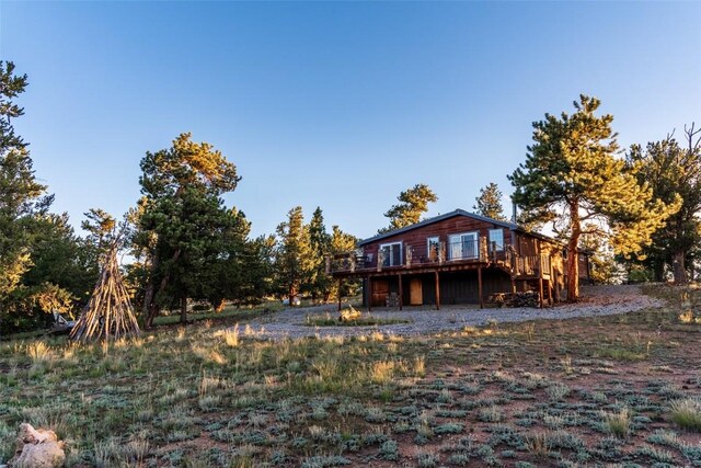 exterior space featuring a wooden deck