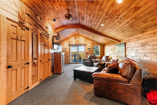 living room featuring vaulted ceiling, dark carpet, wooden walls, and wood ceiling