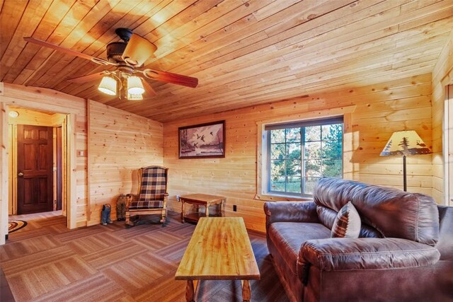 sitting room featuring wood ceiling and wooden walls