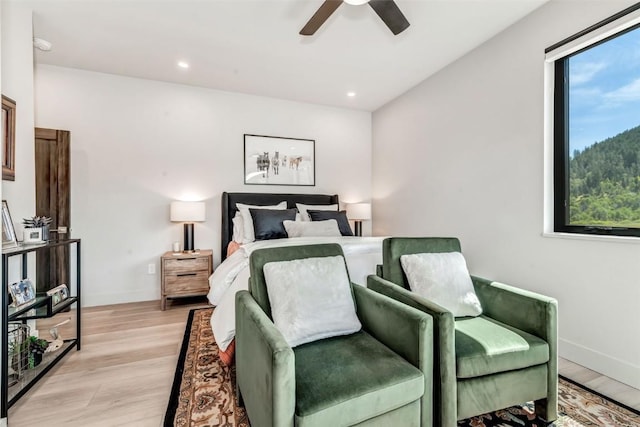 bedroom featuring light wood-type flooring, ceiling fan, baseboards, and recessed lighting