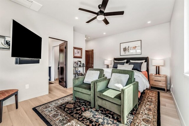 bedroom with baseboards, recessed lighting, a ceiling fan, and light wood-style floors