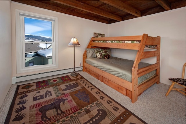 bedroom with baseboard heating, beamed ceiling, carpet, and wood ceiling