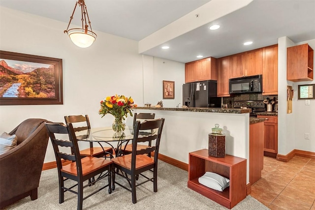 dining room with light tile patterned flooring