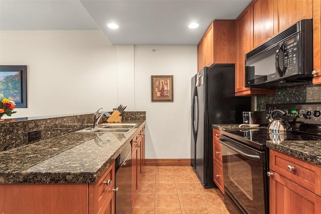 kitchen featuring decorative backsplash, dark stone counters, sink, black appliances, and light tile patterned floors